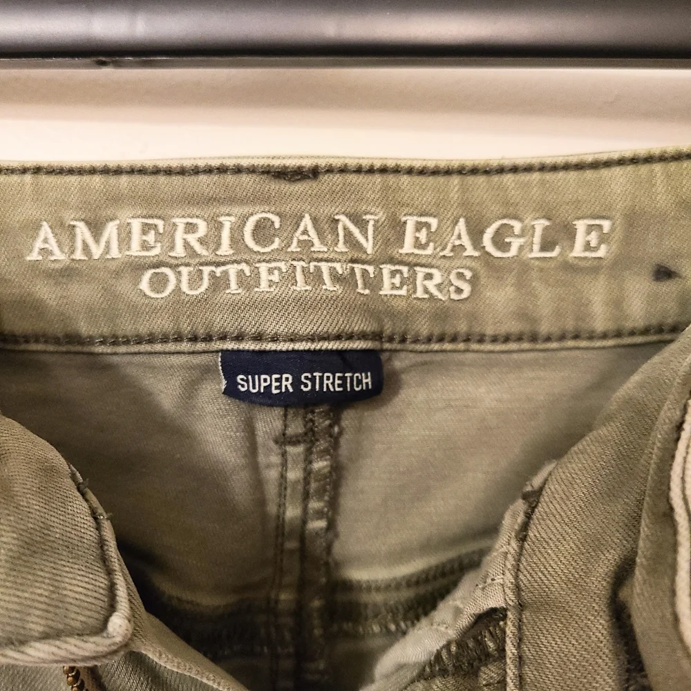 5/$30 American Eagle Super Stretch Army Green Midi Shorts w/ Cuffed Hems - Picture 2 of 4